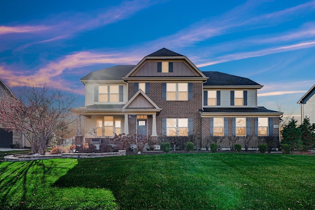 view of front of property with a yard and a porch