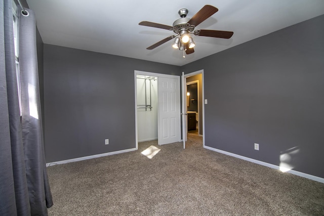 unfurnished bedroom featuring carpet flooring, ceiling fan, and a closet