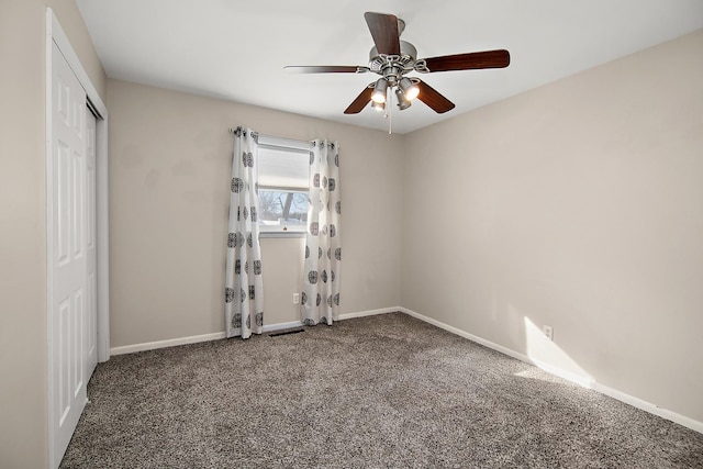 carpeted empty room with ceiling fan