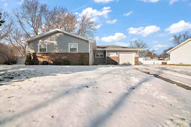 ranch-style house featuring a garage