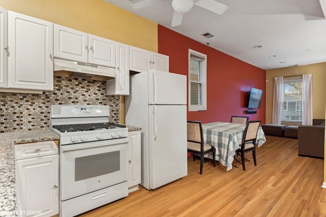 kitchen featuring light hardwood / wood-style flooring, white cabinets, tasteful backsplash, and white appliances