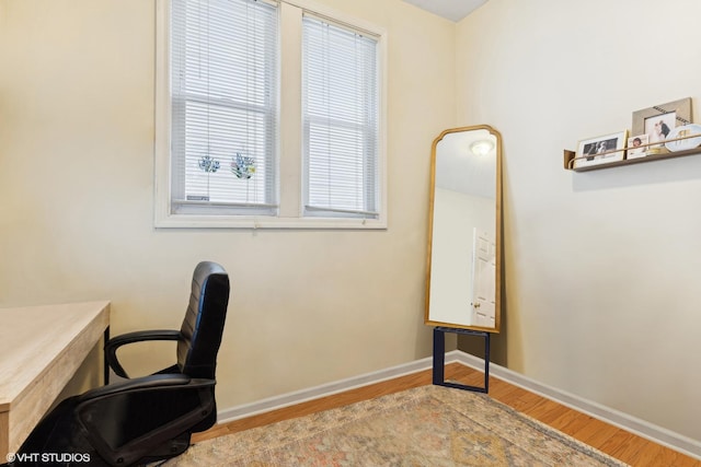 office space with light hardwood / wood-style floors