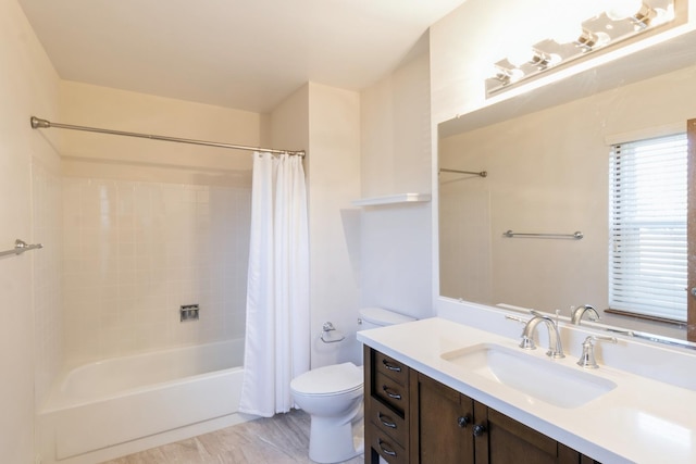 full bathroom featuring shower / bath combo, toilet, and vanity