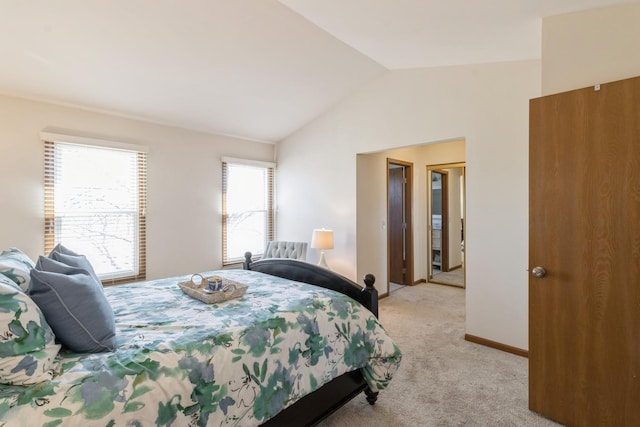 carpeted bedroom featuring vaulted ceiling