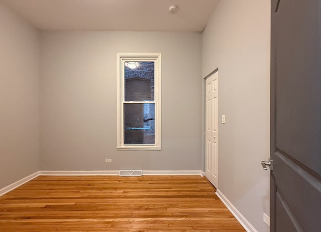 unfurnished room featuring light wood-type flooring