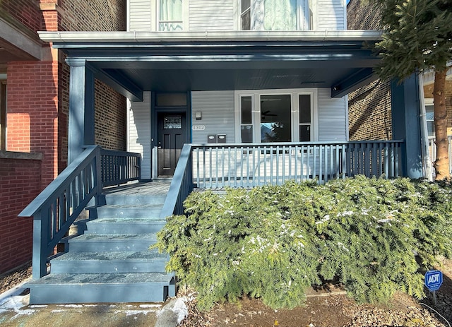 property entrance featuring covered porch