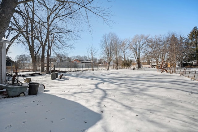 view of yard layered in snow