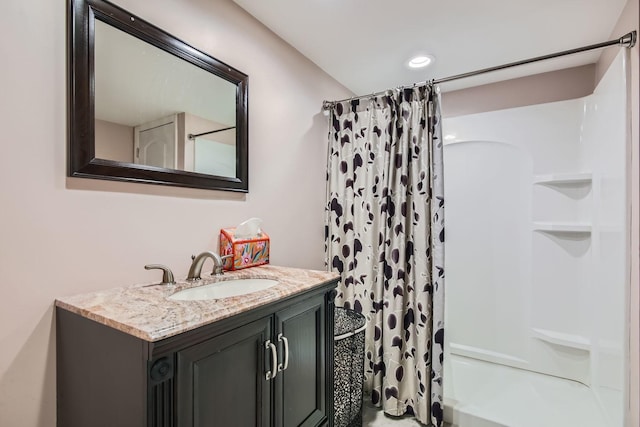 bathroom with vanity and shower / tub combo with curtain