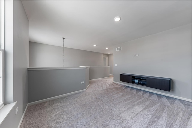 unfurnished room with light colored carpet