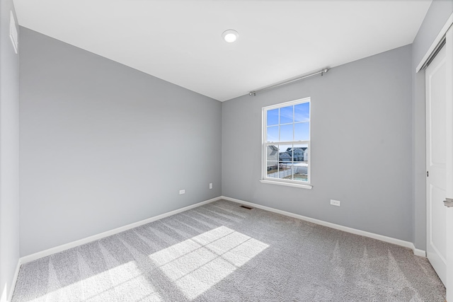 empty room featuring carpet floors