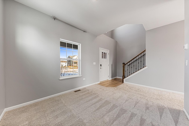 foyer featuring carpet floors