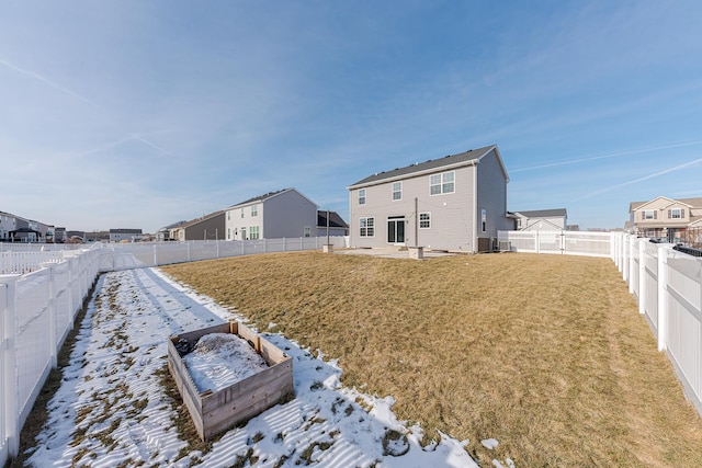 rear view of property featuring a lawn