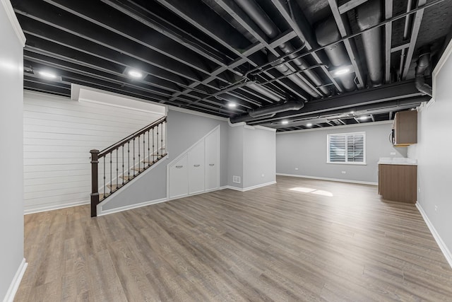 basement with wood-type flooring