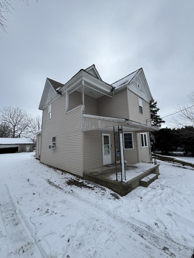 exterior space with cooling unit and a porch