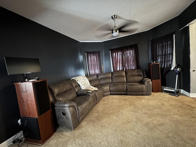 carpeted living room with a textured ceiling and ceiling fan