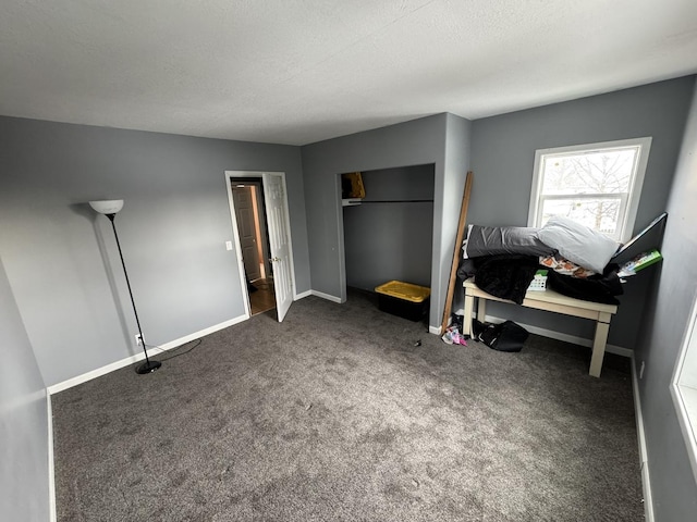 bedroom with dark colored carpet