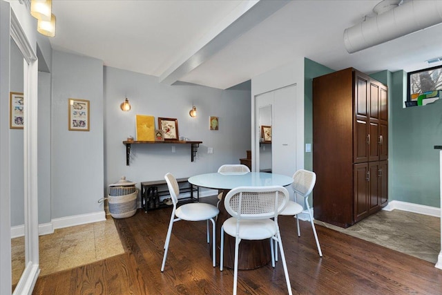 dining space featuring dark hardwood / wood-style flooring