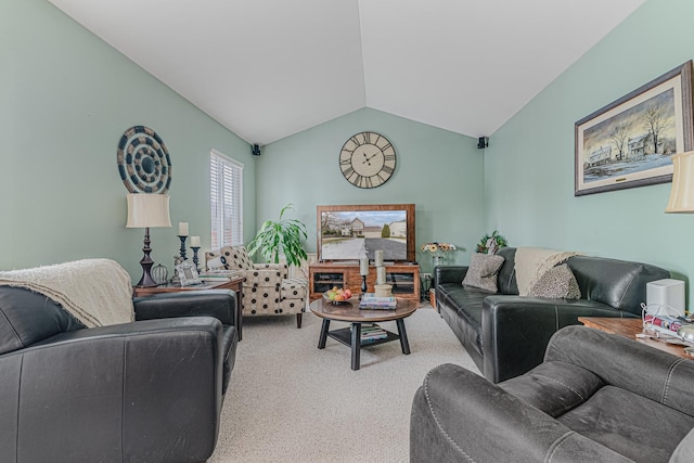 carpeted living room with lofted ceiling