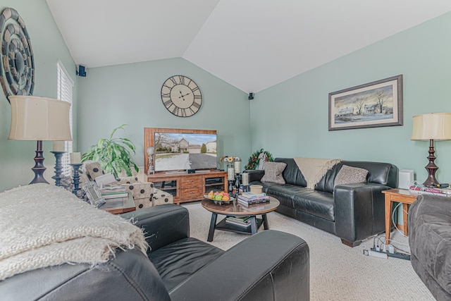 carpeted living room featuring vaulted ceiling