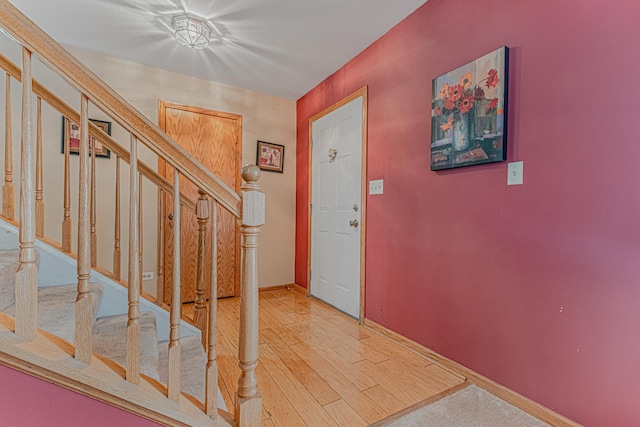 entryway with wood-type flooring