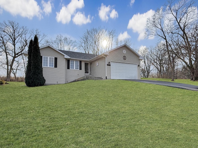 view of front of house with a garage and a front yard