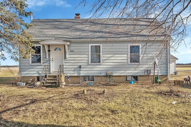 bungalow-style house featuring a front yard