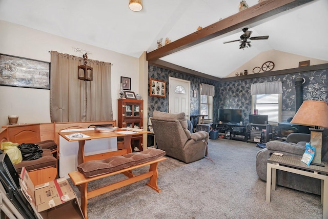 living room with carpet, vaulted ceiling with beams, and ceiling fan