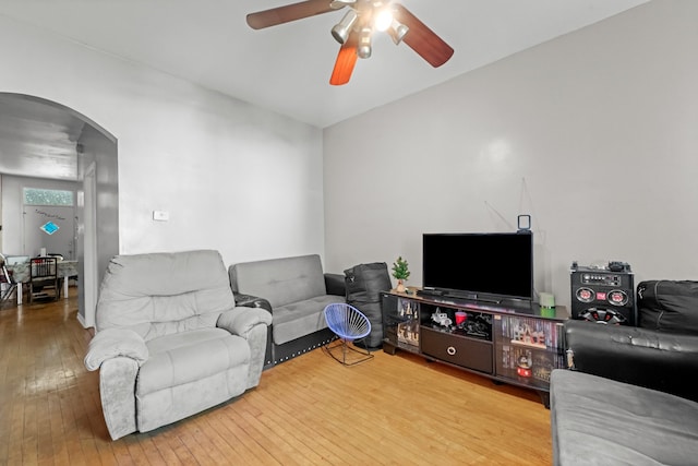 living room with ceiling fan and hardwood / wood-style floors