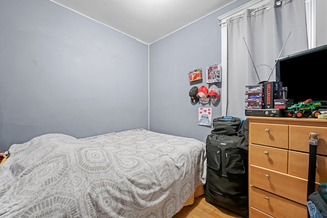 bedroom with light hardwood / wood-style floors