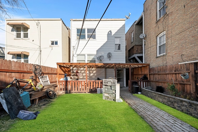 back of house featuring a lawn