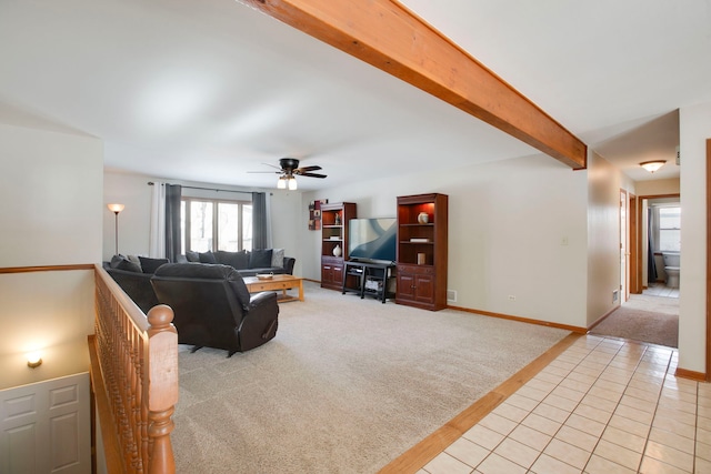 living room with ceiling fan, light carpet, and beam ceiling