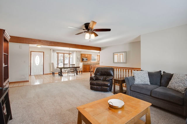 carpeted living room featuring ceiling fan