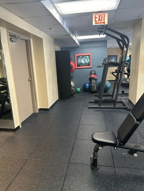 gym featuring a drop ceiling