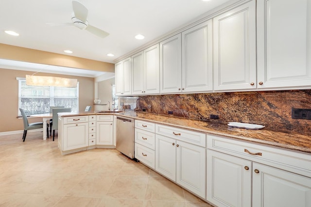 kitchen featuring sink, dishwasher, backsplash, stone countertops, and kitchen peninsula