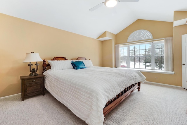 carpeted bedroom featuring vaulted ceiling and ceiling fan