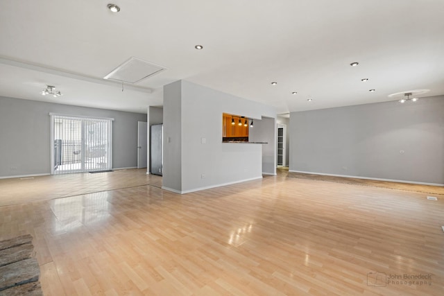 unfurnished living room with light hardwood / wood-style floors