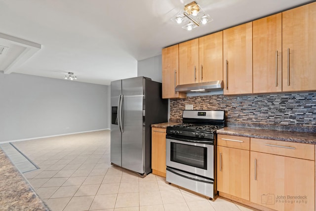 kitchen featuring light tile patterned floors, appliances with stainless steel finishes, decorative backsplash, and light brown cabinets