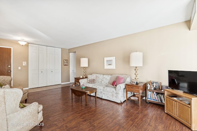 living room with dark hardwood / wood-style floors