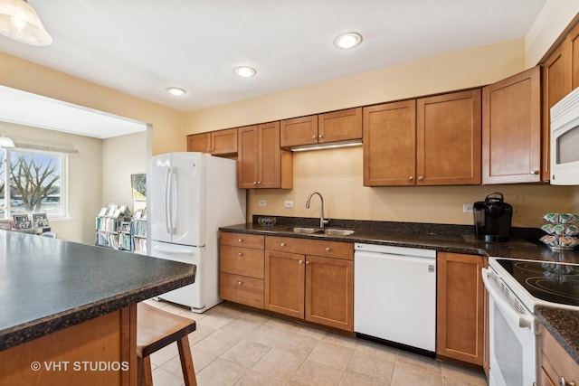 kitchen with sink and white appliances