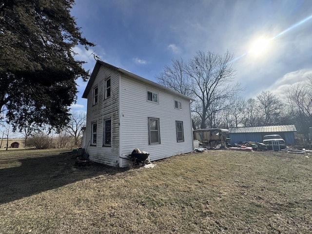 view of home's exterior featuring a yard