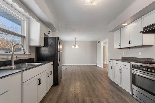 kitchen featuring white cabinetry, sink, dark hardwood / wood-style flooring, and stainless steel range with gas stovetop