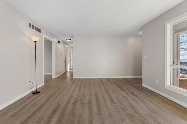 spare room with light hardwood / wood-style floors