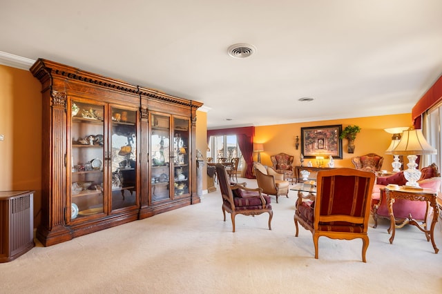 carpeted living room featuring radiator and ornamental molding