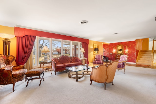 living room featuring crown molding and carpet floors