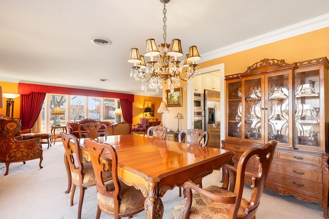 dining space featuring light colored carpet, crown molding, and an inviting chandelier