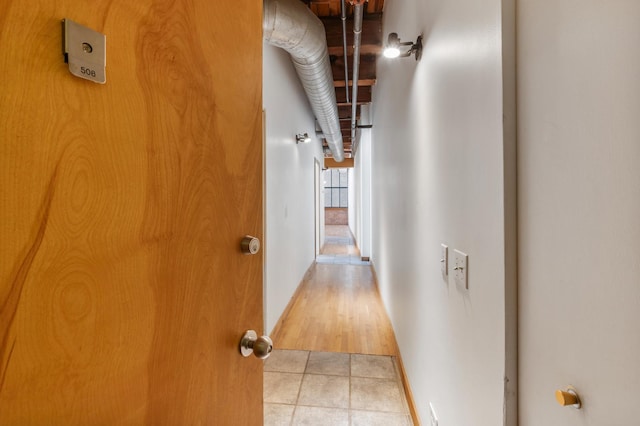 hallway featuring light tile patterned floors