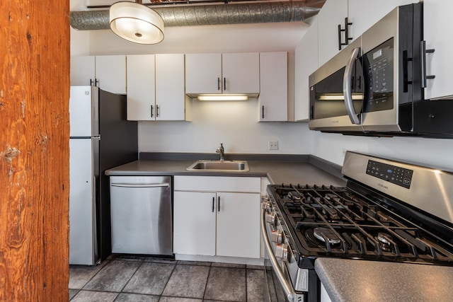 kitchen featuring sink, stainless steel appliances, and white cabinets