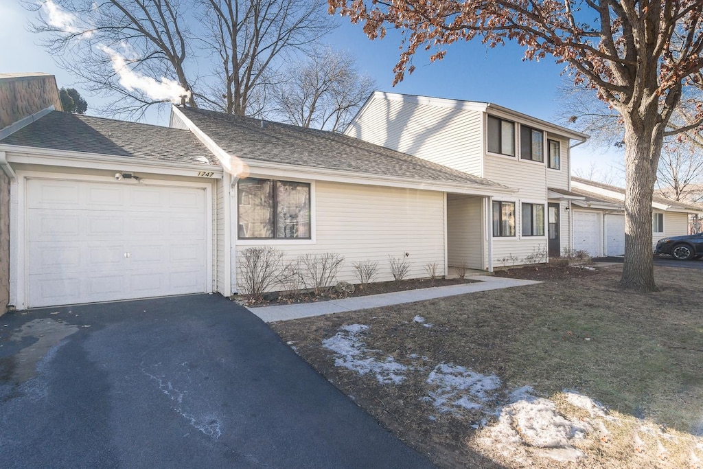 front of property with a garage