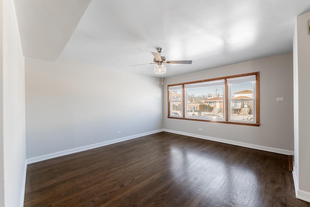 unfurnished room featuring dark hardwood / wood-style floors and ceiling fan