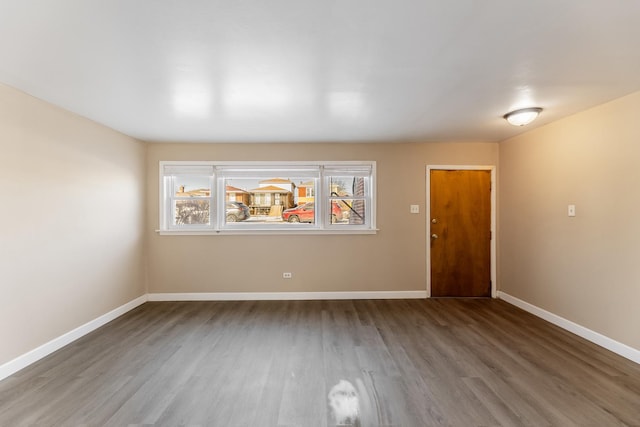 empty room featuring wood-type flooring